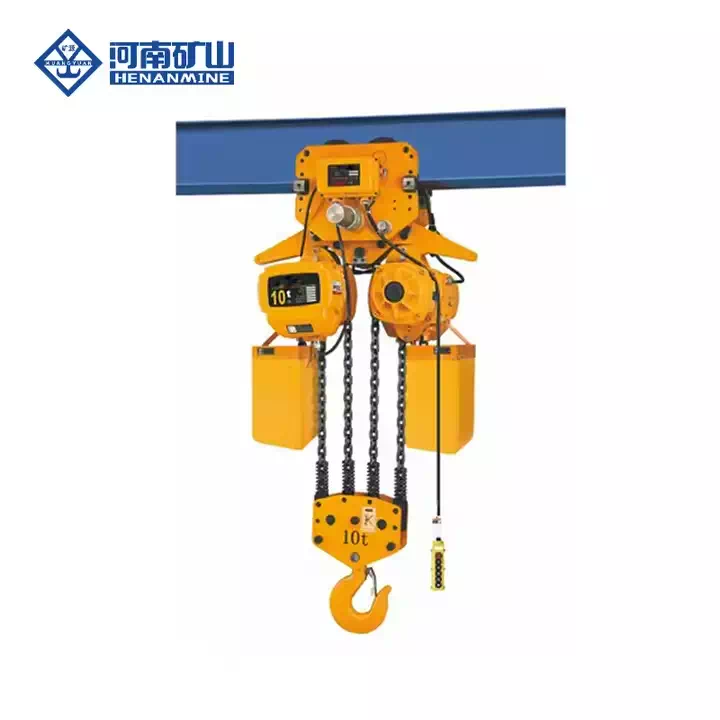 Worker operating a Powered Chain Lifting Hoist in warehouse